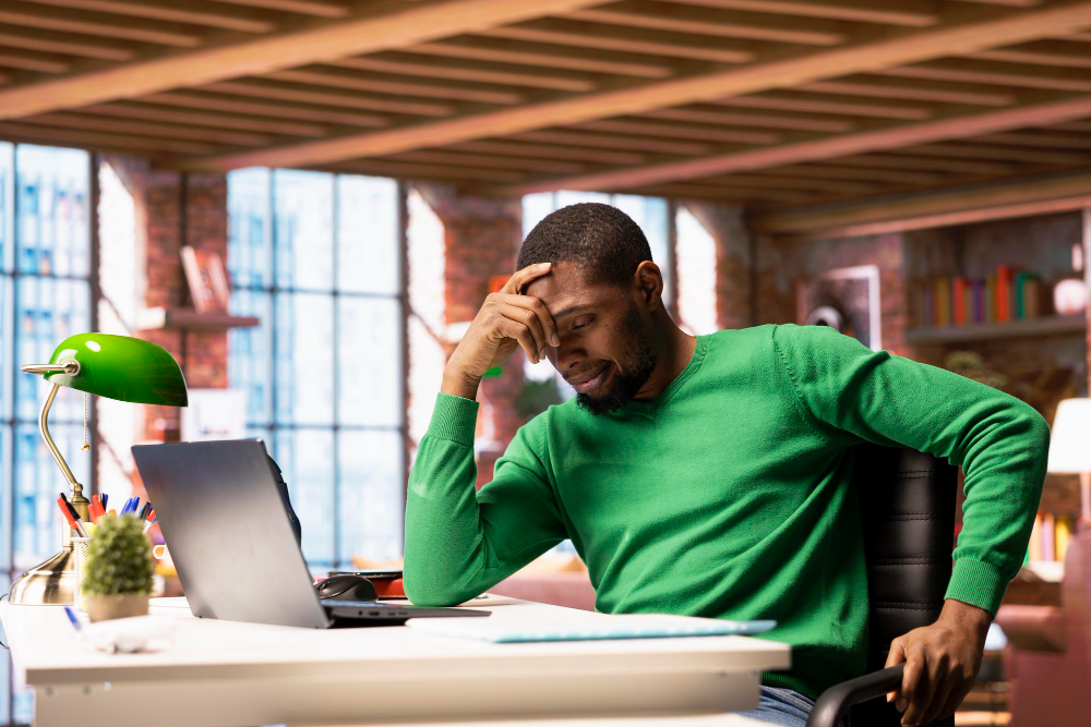 A frustrated tech founder reviewing a bloated developer MVP scope first release