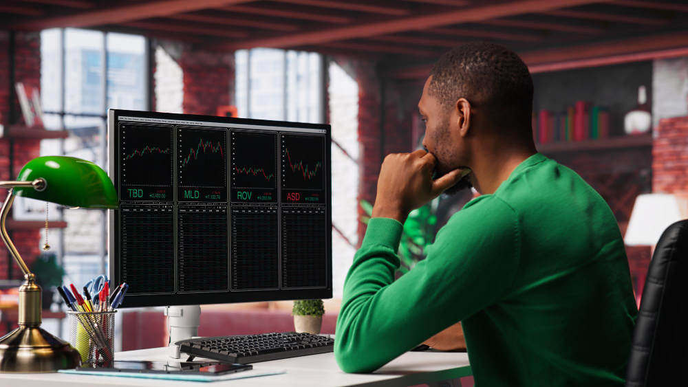 A tech startup founder looking stressed while analyzing product validation data before development, illustrating how to know if you've achieved problem-solution fit.
